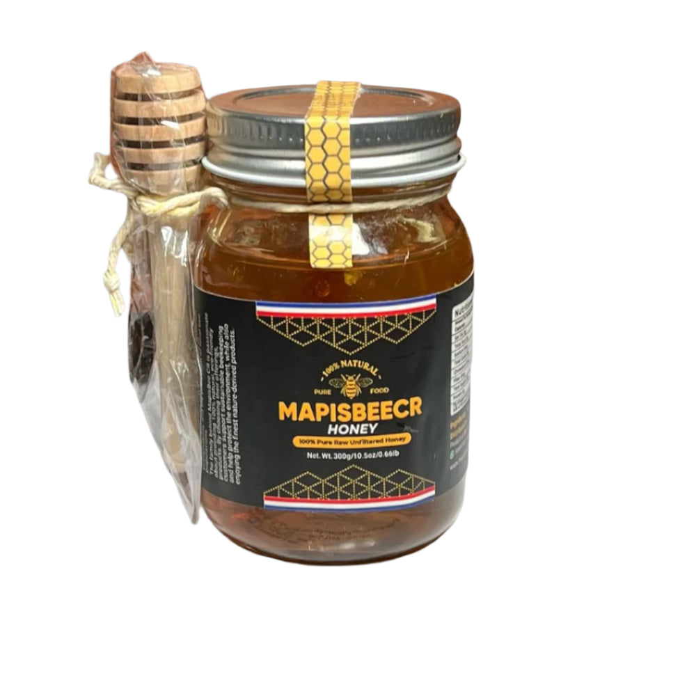 Jar of Mapisbeecr honey with a wooden dipper on a gray background